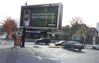 The Penthouse -- Rotating billboard ad for Nokia cellular phones, 'You'll get more cat calls than phone calls.' PHOTO: Andy Sorfleet, Summer, 1999.