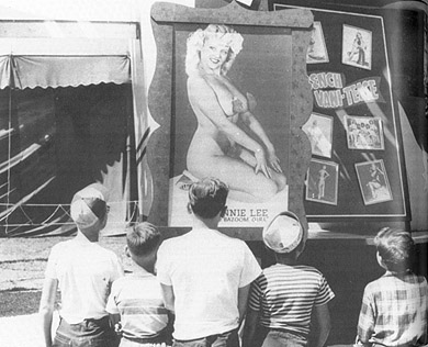 These three boys are clutching their brown bags full of free samples from the Pure Food Building can only imagine what Jennie Lee, the Bazoom Girl, is going to do in the tent behind this show front. In 1954 and 1956, the Bazoom Girl filled the Toronto newspapers while the Canadian National Exhibition -- or Sexhibition, as the papers called it -- was running.