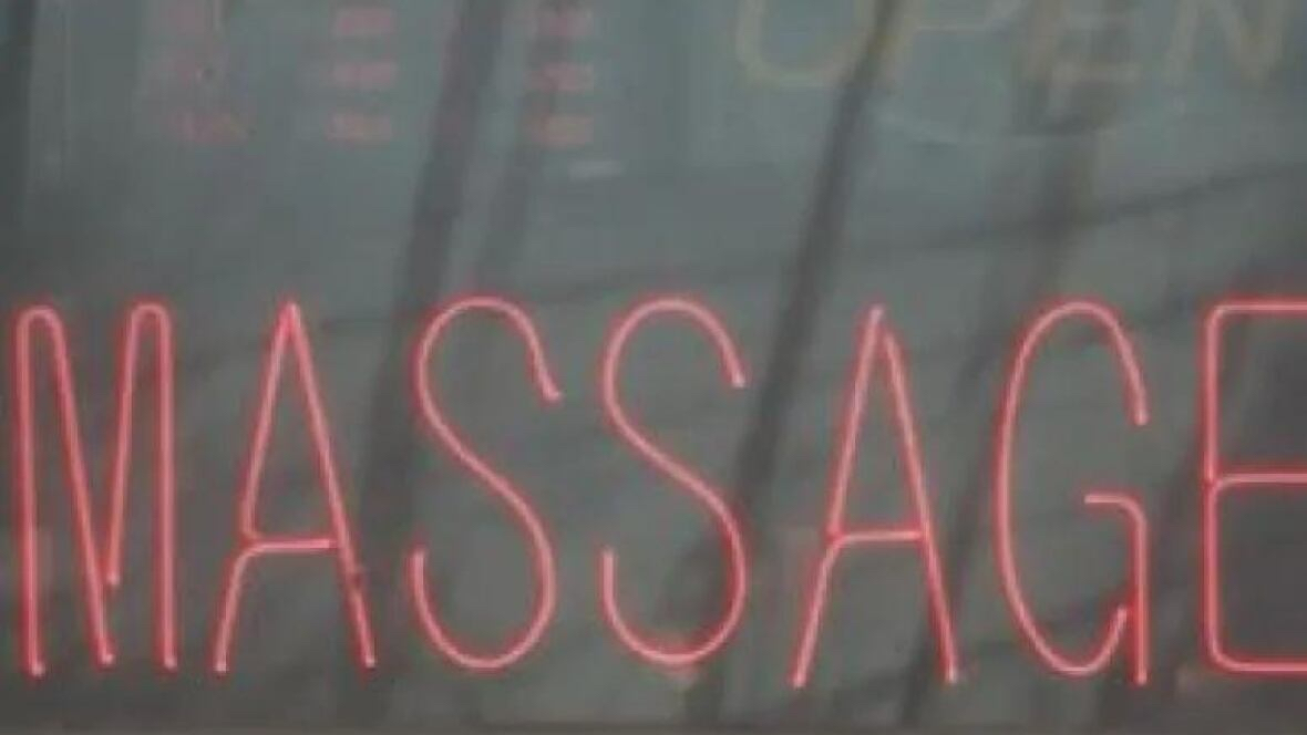 A sign advertises the services of a massage parlour. There are about 20 such establishments in Regina, officials say. (CBC)
