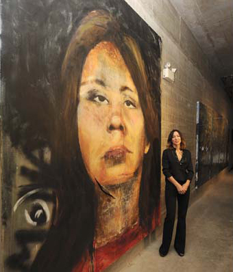 Pamela Masik unviels the first of 69 massive portraits of missing women in Vancouver. This one is Mona Wilson. PHOTO: Glenn Baglo, Vancouver Sun.