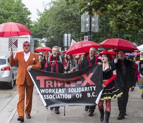 Red Umbrella Rally and March for Sex Work started at Art Gallery in Vancouver, B.C., on June 14, 2014. All in opposition to Conservative Bill C-36. PHOTO: Steve Bosch, PNG