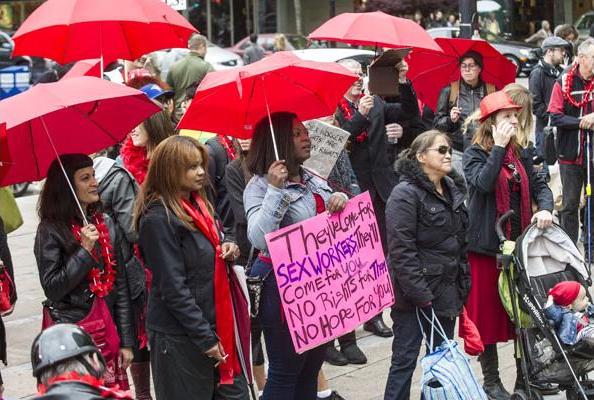 Red Umbrella Rally and March for Sex Work started at Art Gallery in Vancouver, B.C., on June 14, 2014. All in opposition to Conservative Bill C-36. PHOTO: Steve Bosch, PNG