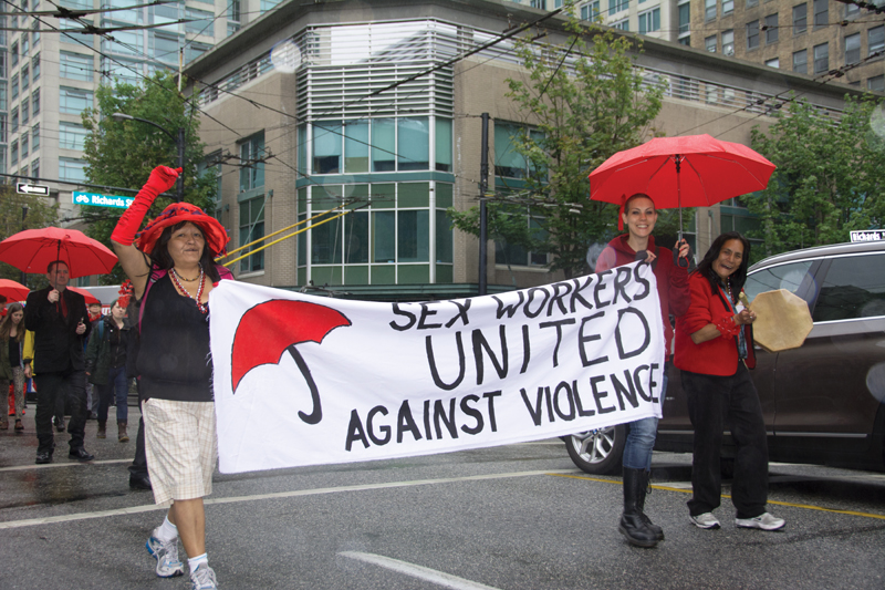 Sex Workers United Against Violence lead the Red Umbrella March for Sex Work Solidarity in Vancouver, 2014. PHOTO: Philip Lo