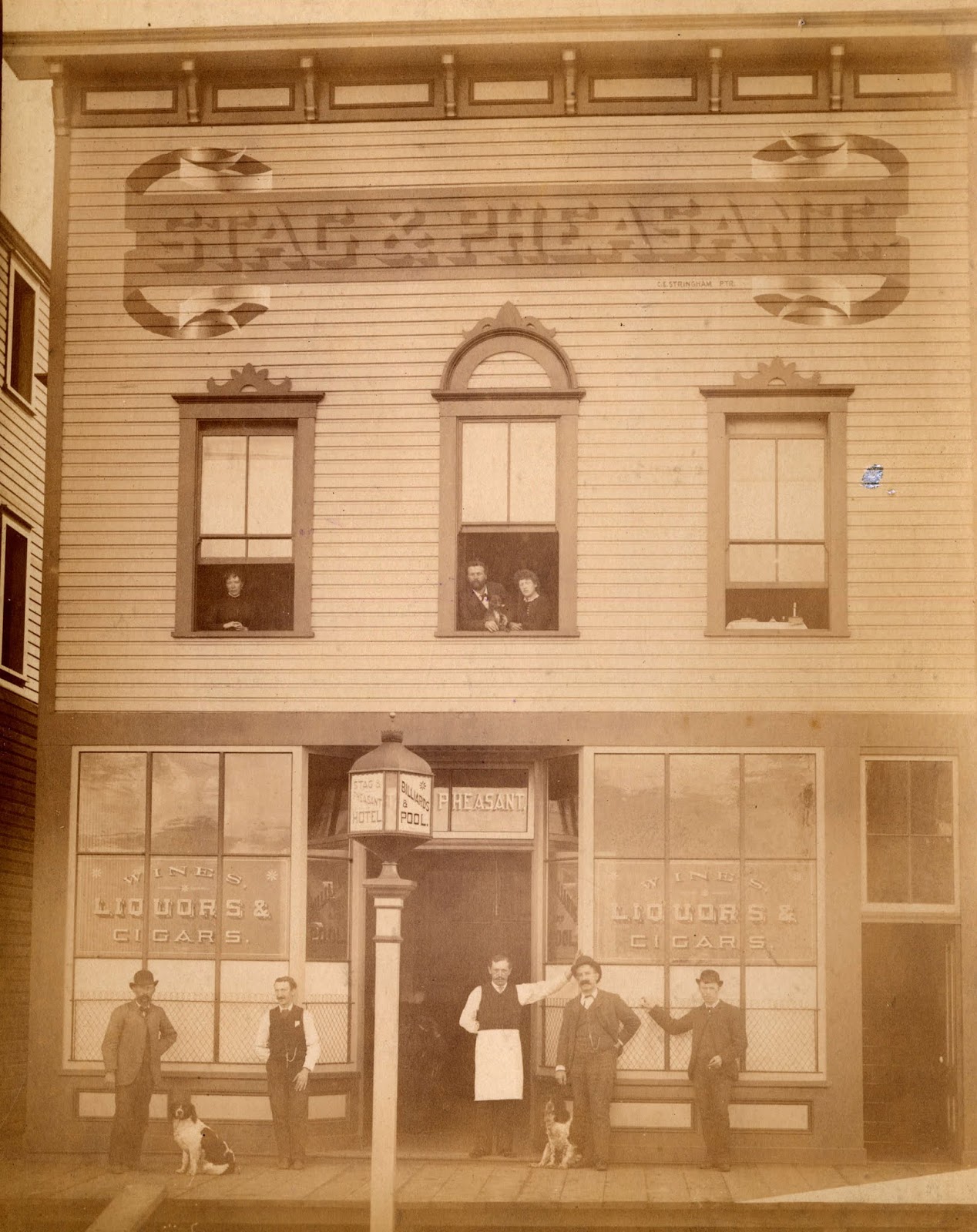 Vancouver's First Illuminated Sign! A result of Vancouver's first liquor bylaw requiring an light over the door. The Stag & Pheasant, Water & Abbott St., 1888. City of Vancouver Archives