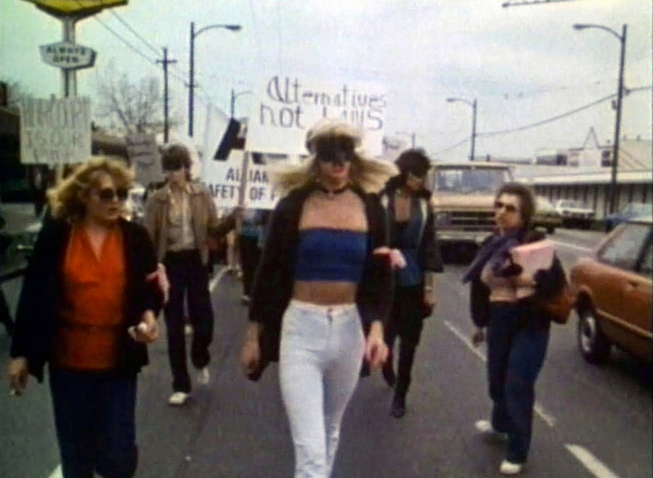 Canada's 1st Modern-Day Protest: Alliance for the Safety of Prostitutes Broadway Street Vancouver, April 20, 1983. Protests followed a B.C. court injunction to move the sex workers out of Vancouver's West End. Film still from Hookers on Davie (1984)