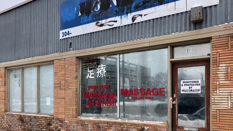 A massage parlour on Notre Dame Avenue was used to sell sexual services, police say. (Gary Solilak/CBC)