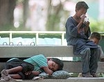 Street children like these in Bangkok are always at risk -- AP